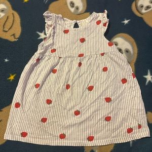 A ruffled casual dress, with cute strawberries on it. Size 6-9 months